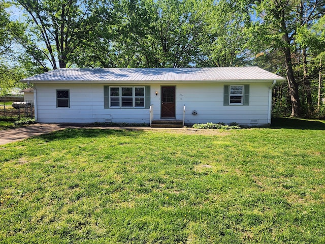 single story home featuring a front yard, metal roof, and entry steps