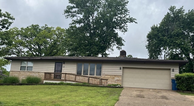 single story home with driveway, a front lawn, a chimney, stone siding, and a garage