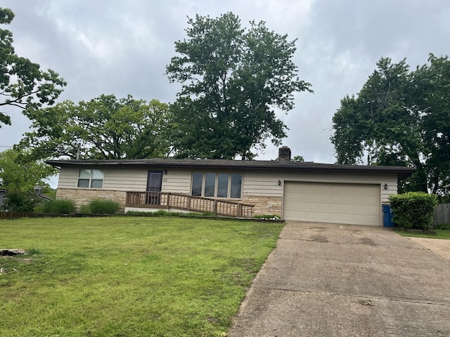 ranch-style home with a garage, concrete driveway, a front lawn, stone siding, and a chimney