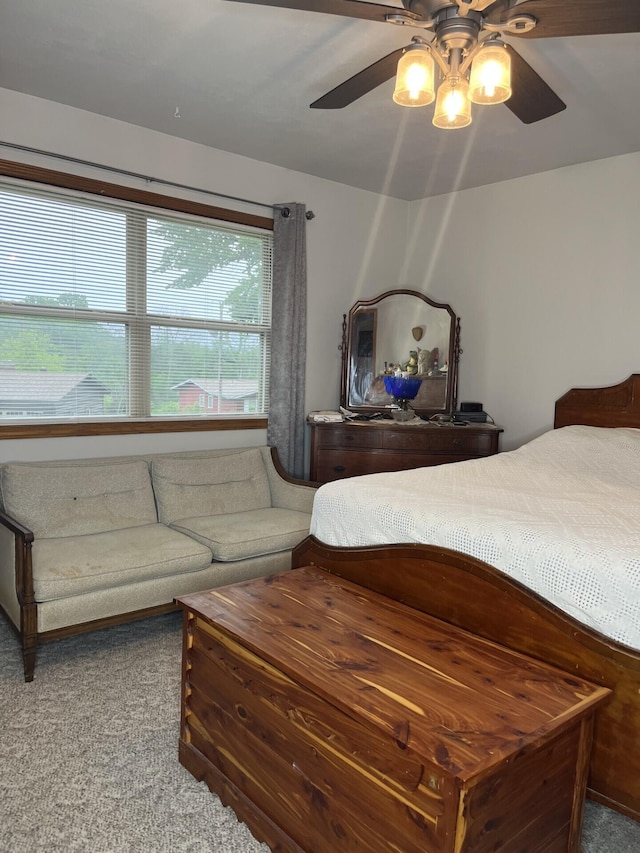 carpeted bedroom with a ceiling fan