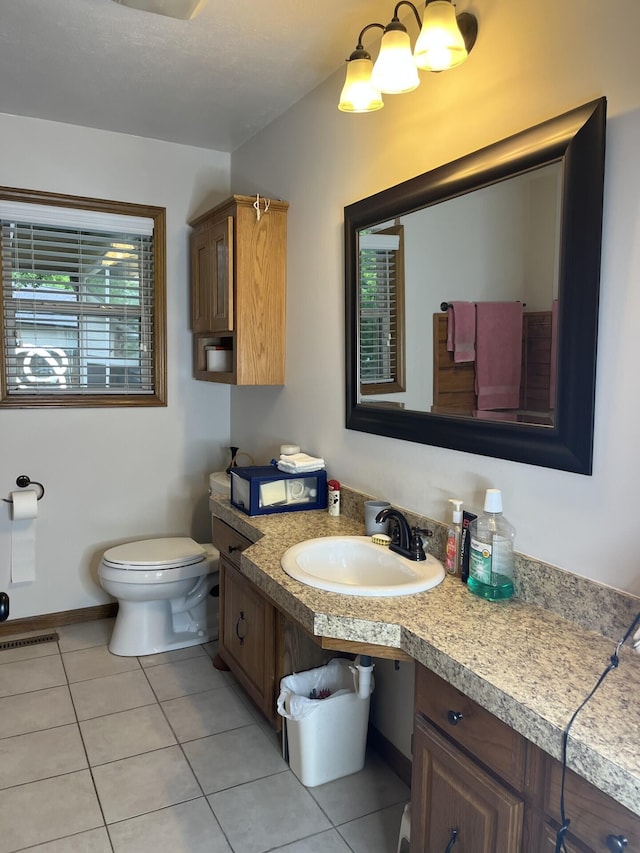 bathroom with tile patterned floors, toilet, and vanity