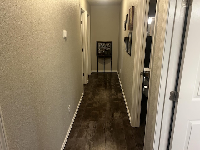 156 Southern Cross Dr, Clever, MO 65631 - hallway featuring dark wood finished floors, a textured wall, and baseboards