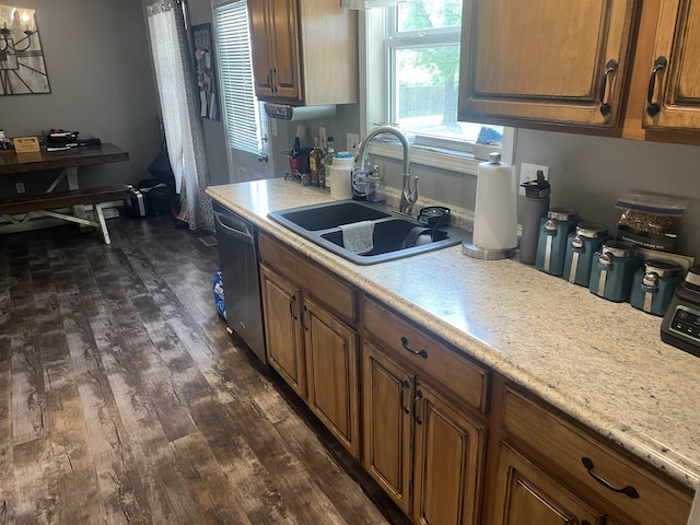 156 Southern Cross Dr, Clever, MO 65631 - kitchen featuring dishwasher, a sink, light countertops, dark wood-type flooring, and brown cabinets