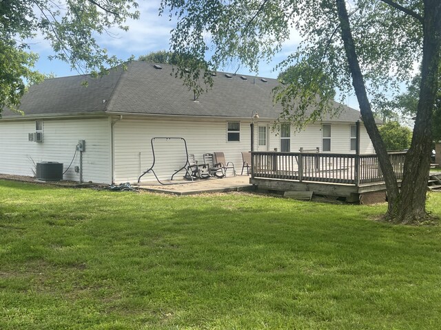156 Southern Cross Dr, Clever, MO 65631 - back of property with a wooden deck, central AC, a lawn, and roof with shingles