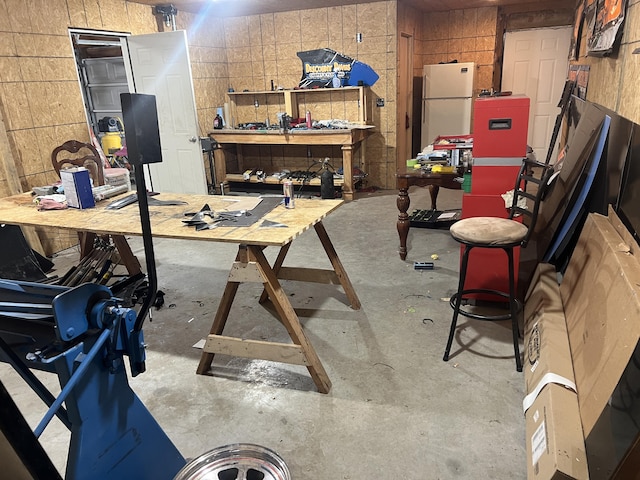 156 Southern Cross Dr, Clever, MO 65631 - below grade area with a workshop area and freestanding refrigerator