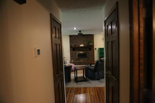 corridor featuring dark wood-style flooring