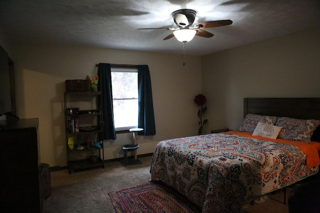 bedroom with carpet flooring, a ceiling fan, and baseboards