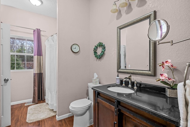 70 Roseville Dr, Rogersville, MO 65742 - full bath featuring wood finished floors, toilet, vanity, baseboards, and a shower with shower curtain