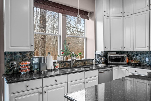 70 Roseville Dr, Rogersville, MO 65742 - kitchen featuring a sink, appliances with stainless steel finishes, white cabinetry, backsplash, and dark stone counters