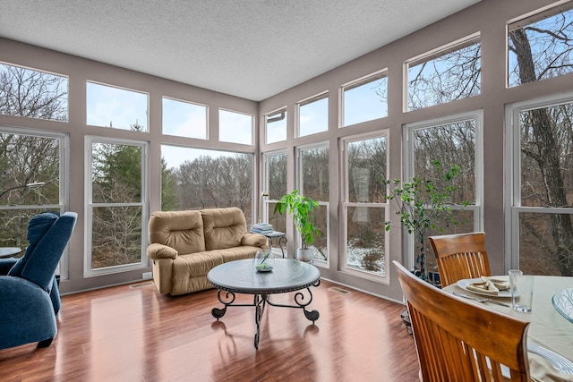 70 Roseville Dr, Rogersville, MO 65742 - sunroom with a textured ceiling, wood finished floors, and a high ceiling