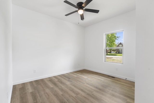 303 W Odell St, Marionville, MO 65705 - unfurnished room featuring wood finished floors, baseboards, and ceiling fan