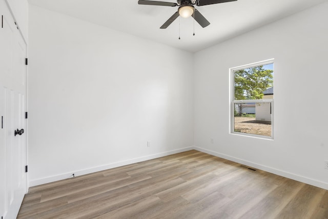 303 W Odell St, Marionville, MO 65705 - empty room featuring light wood-type flooring, ceiling fan, and baseboards