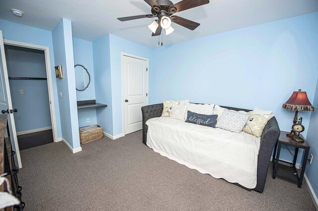 824 E Crystal Ave, Nixa, MO 65714 - bedroom with dark carpet, baseboards, and ceiling fan