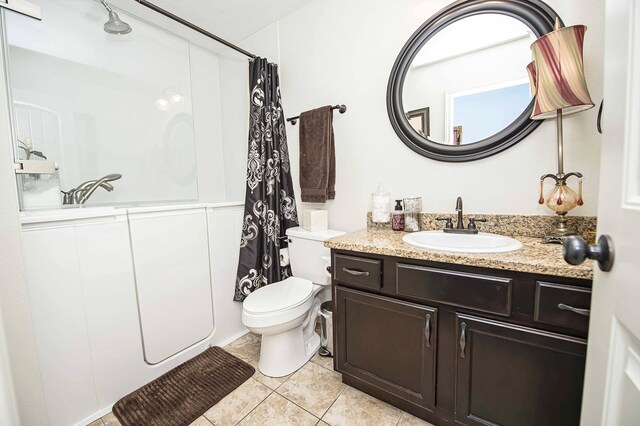 824 E Crystal Ave, Nixa, MO 65714 - bathroom featuring toilet, tile patterned flooring, curtained shower, and vanity