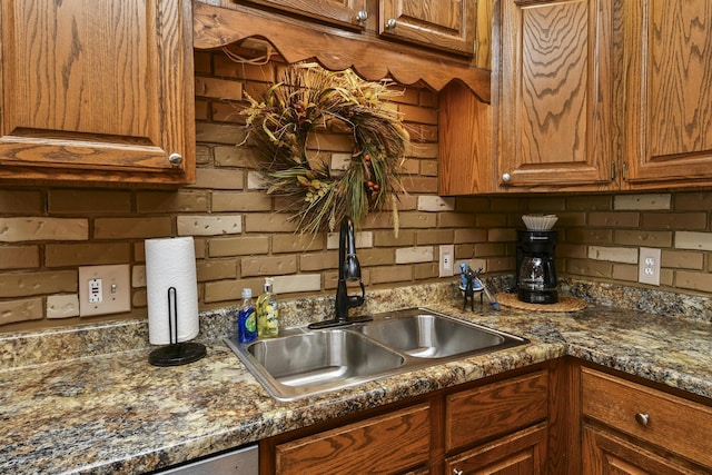 147 Liberty Ln, Kimberling City, MO 65686 - kitchen featuring a sink, backsplash, and brown cabinetry