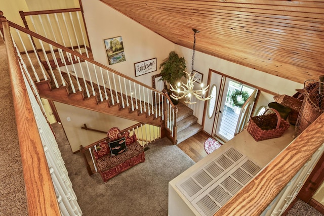 147 Liberty Ln, Kimberling City, MO 65686 - entryway with stairway, a chandelier, carpet, lofted ceiling, and wooden ceiling