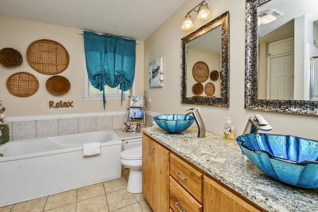 147 Liberty Ln, Kimberling City, MO 65686 - full bathroom with tile patterned flooring, a bath, toilet, and vanity