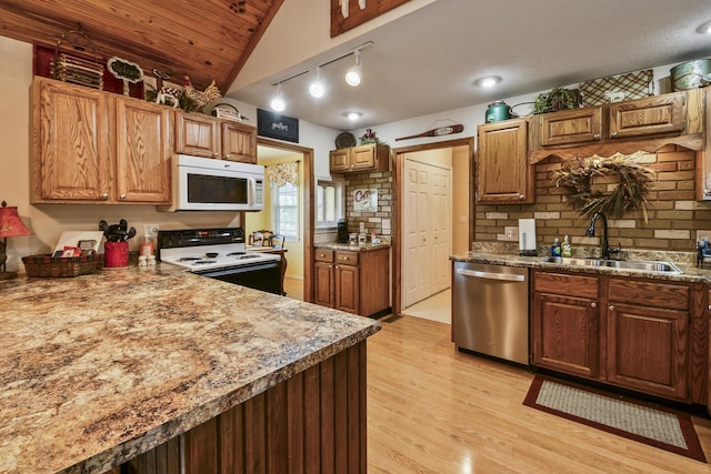 147 Liberty Ln, Kimberling City, MO 65686 - kitchen with white microwave, stainless steel dishwasher, range with electric stovetop, a sink, and light wood finished floors