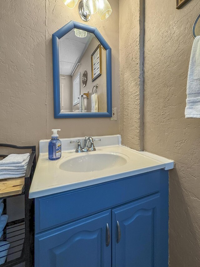 147 Liberty Ln, Kimberling City, MO 65686 - bathroom featuring a textured wall and vanity