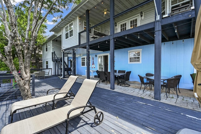 147 Liberty Ln, Kimberling City, MO 65686 - wooden terrace with outdoor dining space, stairway, and ceiling fan