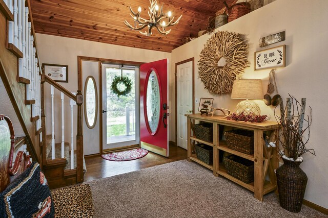 147 Liberty Ln, Kimberling City, MO 65686 - foyer entrance featuring a chandelier, stairs, wood ceiling, lofted ceiling, and baseboards