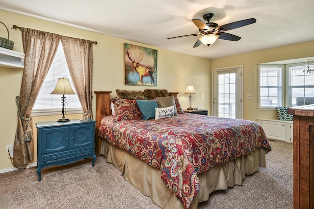 147 Liberty Ln, Kimberling City, MO 65686 - carpeted bedroom with multiple windows and ceiling fan