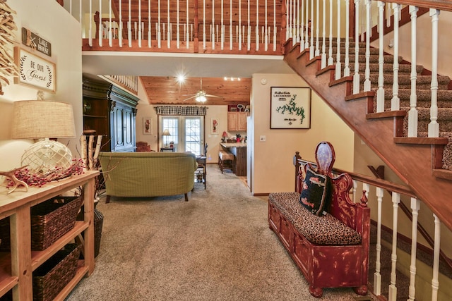 147 Liberty Ln, Kimberling City, MO 65686 - carpeted living room featuring stairway and a ceiling fan