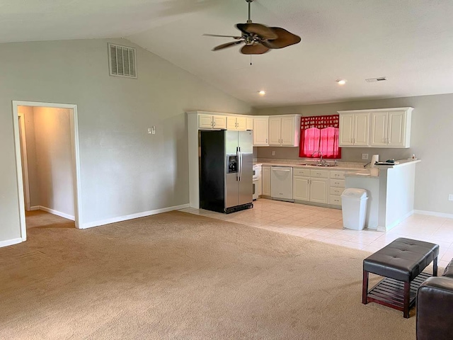 468 Martingale Dr, Theodosia, MO 65761 - kitchen featuring stainless steel fridge, dishwasher, a sink, light carpet, and high vaulted ceiling
