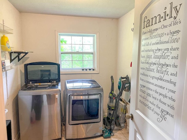 468 Martingale Dr, Theodosia, MO 65761 - clothes washing area with washer and dryer, tile patterned floors, and a textured ceiling