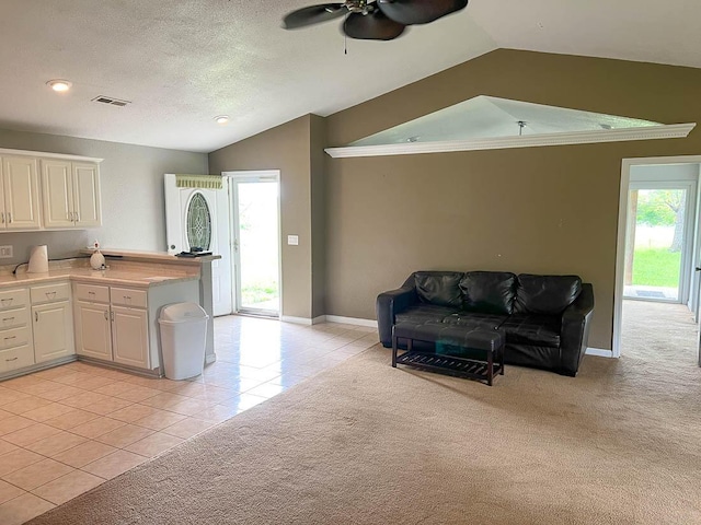 468 Martingale Dr, Theodosia, MO 65761 - kitchen featuring vaulted ceiling, ceiling fan, light tile patterned floors, white cabinets, and a peninsula