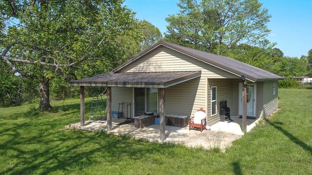 468 Martingale Dr, Theodosia, MO 65761 - rear view of house featuring a patio and a yard