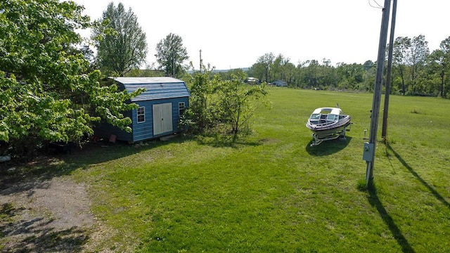 468 Martingale Dr, Theodosia, MO 65761 - view of green lawn featuring a shed and an outdoor structure