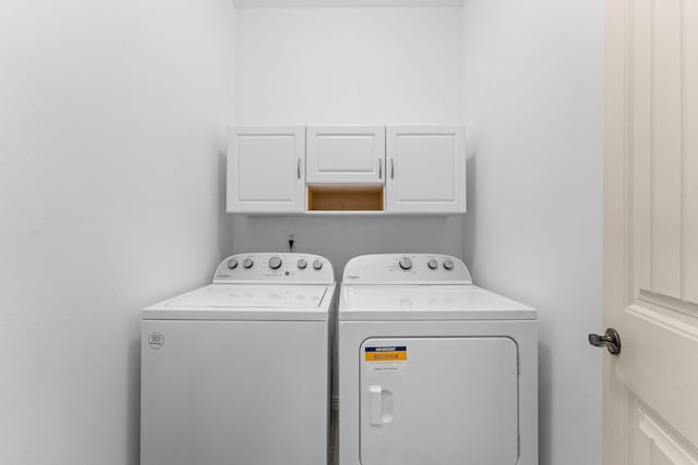 laundry area featuring cabinet space and independent washer and dryer