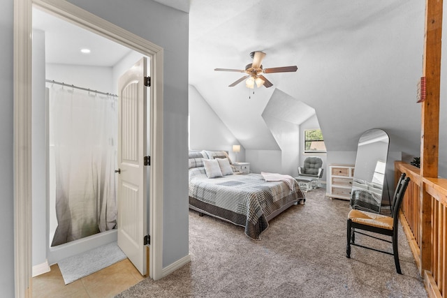 carpeted bedroom featuring vaulted ceiling, baseboards, and ceiling fan