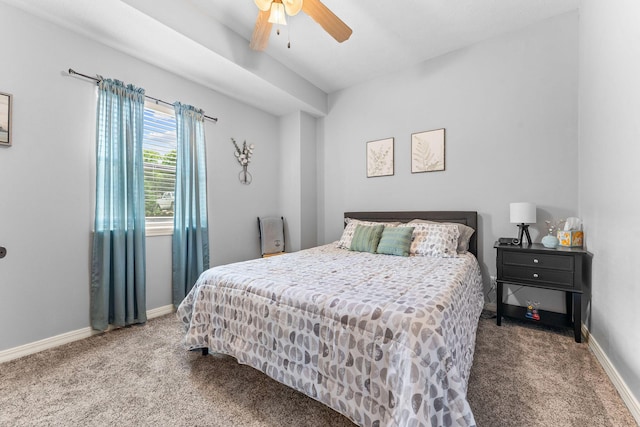 carpeted bedroom featuring baseboards and a ceiling fan