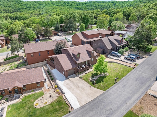 aerial view of residential area with a heavily wooded area