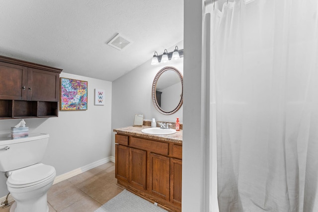 full bathroom with vanity, toilet, baseboards, tile patterned flooring, and a textured ceiling