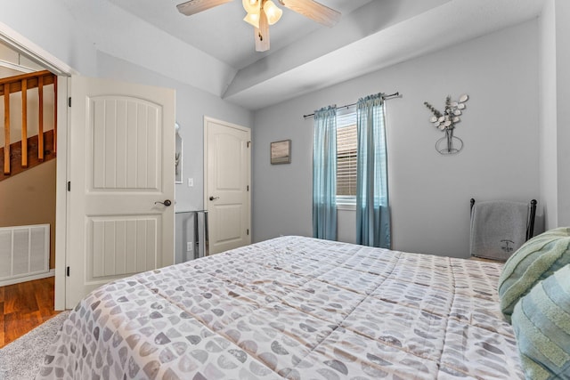 bedroom with wood finished floors and a ceiling fan