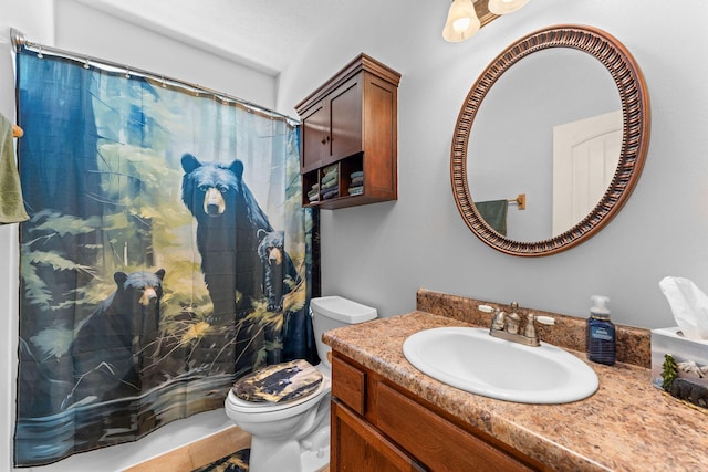full bathroom with toilet, curtained shower, and vanity