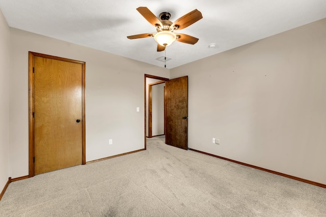 3742 W Village Ter, Springfield, MO 65810 - unfurnished bedroom with light colored carpet, baseboards, a closet, and a ceiling fan