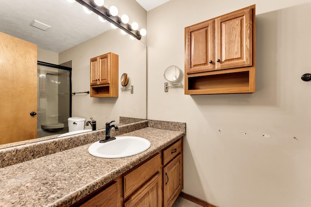 3742 W Village Ter, Springfield, MO 65810 - bathroom with an enclosed shower, vanity, and toilet