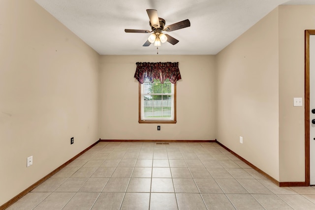 3742 W Village Ter, Springfield, MO 65810 - spare room featuring ceiling fan, baseboards, and light tile patterned flooring