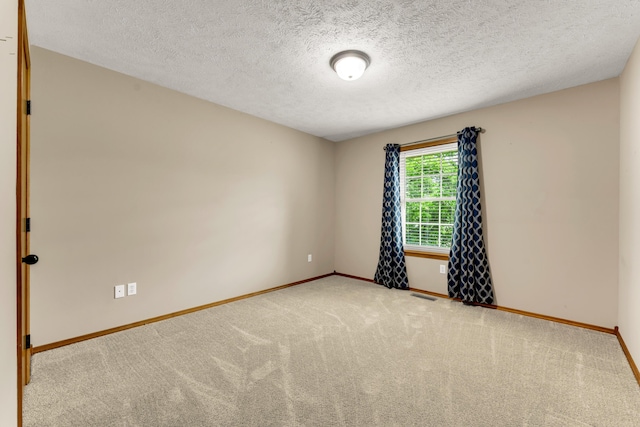 3742 W Village Ter, Springfield, MO 65810 - empty room with baseboards, carpet floors, and a textured ceiling