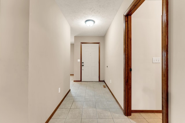 3742 W Village Ter, Springfield, MO 65810 - corridor with light tile patterned floors, baseboards, and a textured ceiling