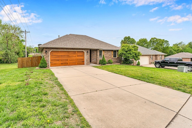 3742 W Village Ter, Springfield, MO 65810 - ranch-style home with brick siding, a shingled roof, a garage, and concrete driveway