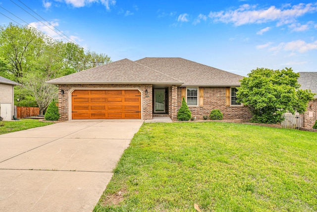 3742 W Village Ter, Springfield, MO 65810 - ranch-style home with brick siding, concrete driveway, roof with shingles, and a garage