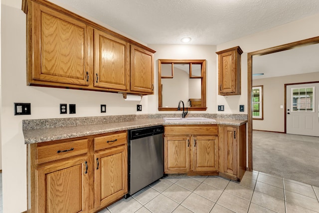 3742 W Village Ter, Springfield, MO 65810 - kitchen with stainless steel dishwasher, a sink, light countertops, light tile patterned floors, and light colored carpet