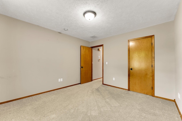 3742 W Village Ter, Springfield, MO 65810 - unfurnished bedroom with baseboards, carpet flooring, and a textured ceiling