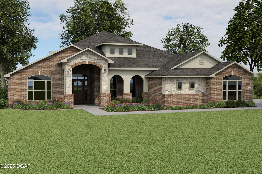 view of front of house featuring a front yard, brick siding, and a shingled roof