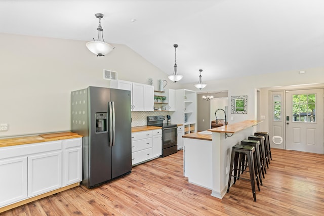 245 Country Hills Rd, Branson, MO 65616 - kitchen with wood counters, black electric range oven, stainless steel fridge with ice dispenser, vaulted ceiling, and open shelves